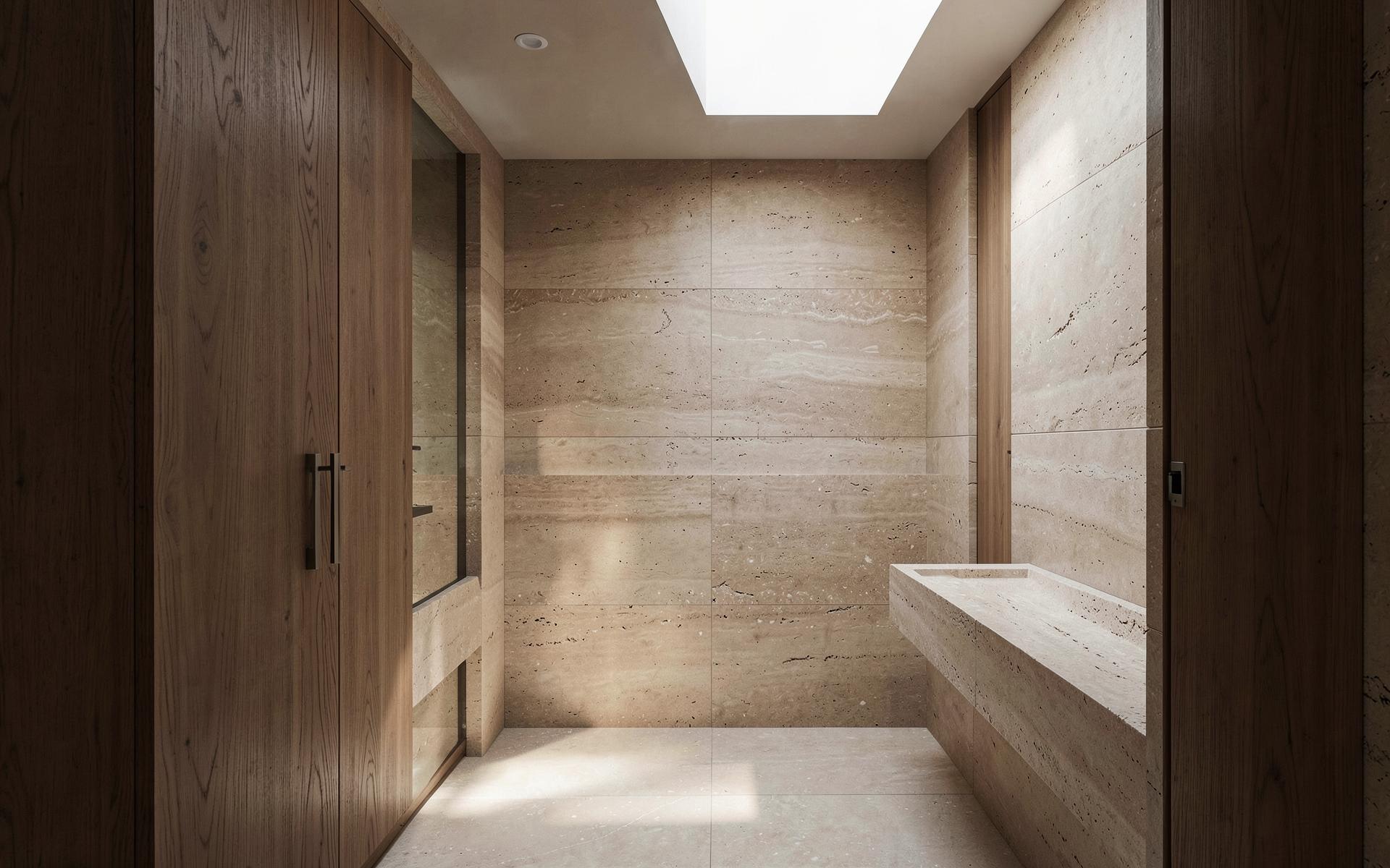 Minimal bathroom clad in warm stone-look tiles with oak joinery
